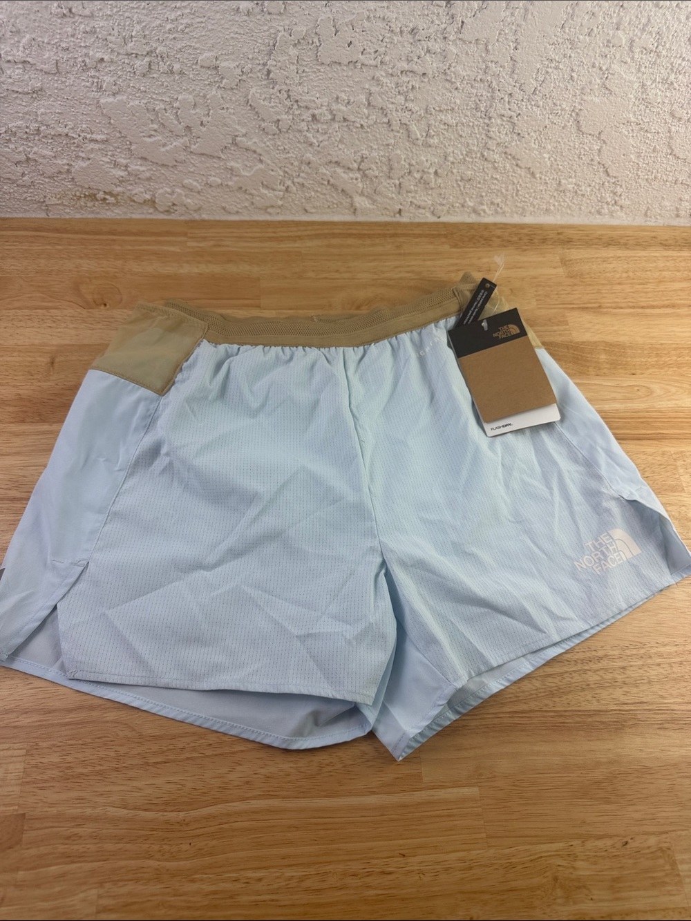The North Face Women's Pale Blue Athletic Shorts with Tan Waistband